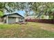 Spacious backyard with a wooden deck and a hammock at 1312 E Louise Ave, Tampa, FL 33603