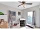 Charming bedroom with two windows and ceiling fan at 1312 E Louise Ave, Tampa, FL 33603