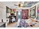 Bohemian-style bedroom with colorful tapestries and a writing desk at 1312 E Louise Ave, Tampa, FL 33603