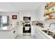 Bright and airy kitchen featuring white cabinets and hexagon tile floor at 1312 E Louise Ave, Tampa, FL 33603