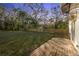 Large backyard with wooden deck and privacy fence at 1919 E Hamilton Ave, Tampa, FL 33610