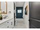 Modern bathroom with blue tile and a white vanity at 1919 E Hamilton Ave, Tampa, FL 33610