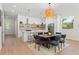 Open dining area with modern chandelier and hardwood floors at 1919 E Hamilton Ave, Tampa, FL 33610