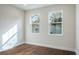 Well-lit bedroom with hardwood floors and large windows at 2509 Mario Way, Clearwater, FL 33761