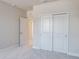 Bedroom with double door closet and an adjoining bathroom at 2509 Mario Way, Clearwater, FL 33761