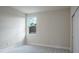 Spacious bedroom with neutral walls, carpeted floor and a window at 2509 Mario Way, Clearwater, FL 33761