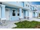 Light blue home with white front door and stone accents at 2509 Mario Way, Clearwater, FL 33761