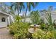 Peaceful backyard oasis with a stone fountain and lush landscaping at 860 25Th N Ave, St Petersburg, FL 33704