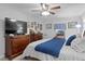 Spacious bedroom with large bed, dresser, and ceiling fan at 860 25Th N Ave, St Petersburg, FL 33704