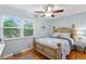 Cozy bedroom with wooden bed frame and light blue walls at 860 25Th N Ave, St Petersburg, FL 33704