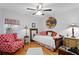 Charming bedroom with daybed, ceiling fan, and hardwood floors at 860 25Th N Ave, St Petersburg, FL 33704