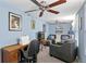 Cozy living room featuring a sectional sofa and a workspace at 860 25Th N Ave, St Petersburg, FL 33704