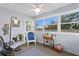 Relaxing sunroom with rocking chair, ample natural light, and ceiling fan at 860 25Th N Ave, St Petersburg, FL 33704