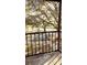 Covered balcony overlooking a tree-filled parking area at 11701 Raintree Village Blvd # C, Temple Terrace, FL 33617