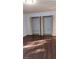 Large bedroom closet with double doors and shelving at 11701 Raintree Village Blvd # C, Temple Terrace, FL 33617