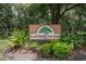 RainTree Village entrance sign with lush landscaping at 11701 Raintree Village Blvd # C, Temple Terrace, FL 33617