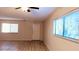 Living room with front door and large window at 11701 Raintree Village Blvd # C, Temple Terrace, FL 33617