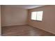 Spacious living room with wood-look flooring at 11701 Raintree Village Blvd # C, Temple Terrace, FL 33617