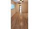 Living room with new wood-look flooring and access to patio at 11701 Raintree Village Blvd # C, Temple Terrace, FL 33617