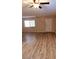 Living Room with wood-look floors and ceiling fan at 11701 Raintree Village Blvd # C, Temple Terrace, FL 33617