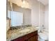Bathroom with granite vanity and a bathtub at 12403 Ballentrae Forest Dr, Riverview, FL 33579