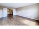 Spacious bedroom with wood-look floors and double doors at 12403 Ballentrae Forest Dr, Riverview, FL 33579