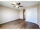 Bedroom with wood-look floors, double closet and ceiling fan at 12403 Ballentrae Forest Dr, Riverview, FL 33579
