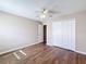 Bedroom with wood-look floors, double closet and ceiling fan at 12403 Ballentrae Forest Dr, Riverview, FL 33579