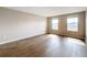 Bright bedroom with wood-look floors and neutral walls at 12403 Ballentrae Forest Dr, Riverview, FL 33579
