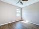 Bright bedroom featuring wood-look floors and a window at 12403 Ballentrae Forest Dr, Riverview, FL 33579