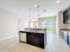 Island kitchen with granite countertops and stainless steel appliances at 12403 Ballentrae Forest Dr, Riverview, FL 33579