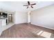 Bright living room features wood-look floors and ceiling fan at 12403 Ballentrae Forest Dr, Riverview, FL 33579