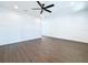 Spacious living room featuring wood-look floors and ceiling fan at 8113 N Edison Ave, Tampa, FL 33604