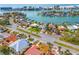 Aerial view of the house and neighborhood, highlighting its waterfront location at 10088 Paradise Blvd, Treasure Island, FL 33706