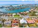 Wide aerial showcasing the location of the house on the waterfront at 10088 Paradise Blvd, Treasure Island, FL 33706