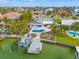 Aerial view of waterfront home with private dock and pool at 10088 Paradise Blvd, Treasure Island, FL 33706