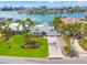 Waterfront property aerial view, showcasing the house and surrounding neighborhood at 10088 Paradise Blvd, Treasure Island, FL 33706