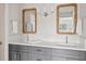 Modern bathroom with double vanity and large mirrors at 10088 Paradise Blvd, Treasure Island, FL 33706