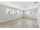 Bright bedroom with wood-look floors and ceiling fan at 10088 Paradise Blvd, Treasure Island, FL 33706