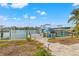 Private boat dock with lift and waterfront views at 10088 Paradise Blvd, Treasure Island, FL 33706