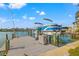 Private boat dock featuring a lift for easy boat access at 10088 Paradise Blvd, Treasure Island, FL 33706