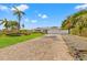 House exterior with brick driveway and landscaping at 10088 Paradise Blvd, Treasure Island, FL 33706