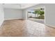 Bright Gathering room with tile floors and access to backyard at 10088 Paradise Blvd, Treasure Island, FL 33706