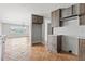 Modern kitchen with wood cabinets, stainless steel appliances, and white countertops at 10088 Paradise Blvd, Treasure Island, FL 33706