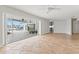 Living room with tile floors and sliding doors to patio at 10088 Paradise Blvd, Treasure Island, FL 33706