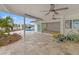 Spacious patio overlooking pool and canal at 10088 Paradise Blvd, Treasure Island, FL 33706