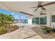 Covered patio with water views and pool access at 10088 Paradise Blvd, Treasure Island, FL 33706