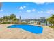 Relaxing pool area with water view at 10088 Paradise Blvd, Treasure Island, FL 33706