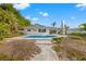 Private pool and patio with walkway leading to the home at 10088 Paradise Blvd, Treasure Island, FL 33706