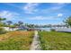 Private backyard with a path to the waterfront dock at 43 Leeward Is, Clearwater Beach, FL 33767